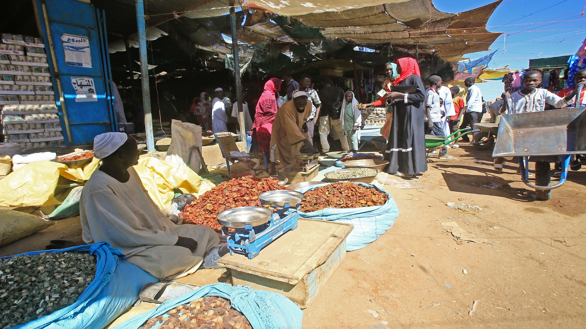 Diplaced Sudanese shop at the market of the Abu Shouk camp for internally displaced persons, nearly 20 kms north of El-Fasher, the capital of the North Darfur state, on November 5, 2019. - Sudan's Prime Minister Abdalla Hamdok visted war-torn Darfur yesterday and met with hundreds of victims of the conflict in Al-Fashir, assuring them that his government was working towards bringing peace to a devastated region which has recorded hundreds of thousands dead and millions displaced since the conflict erupted in 2003. (Photo by ASHRAF SHAZLY / AFP) (Photo by ASHRAF SHAZLY/AFP via Getty Images)