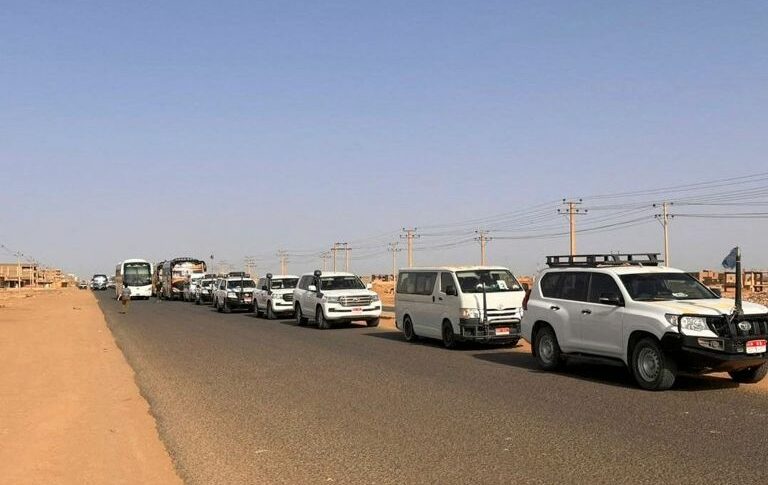 A-convoy-leaving-Khartoum-Sudans-capital-advances-on-a-road-toward-Port-Sudan-on-April-23-2023-AFP--768x485